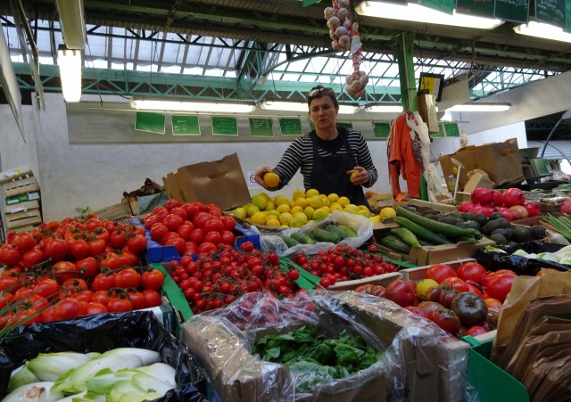 Vibrant food stalls inside the historic Marche des Enfants Rouges covered market in Paris