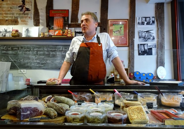 A selection of French cheeses and pates being prepared for a tasting on a Context Travel tour