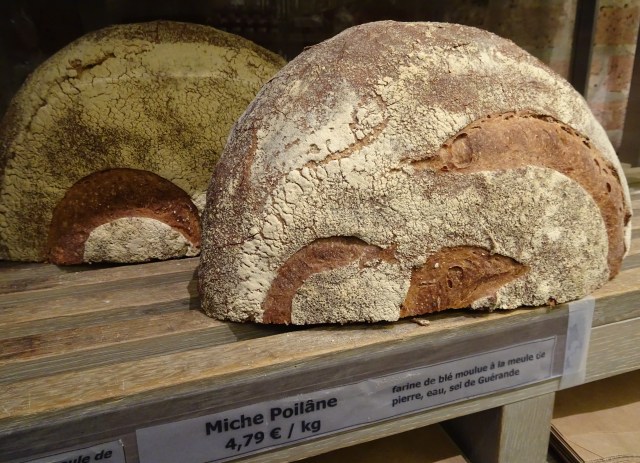 Fresh breads on display at a traditional bakery during a Paris food tour