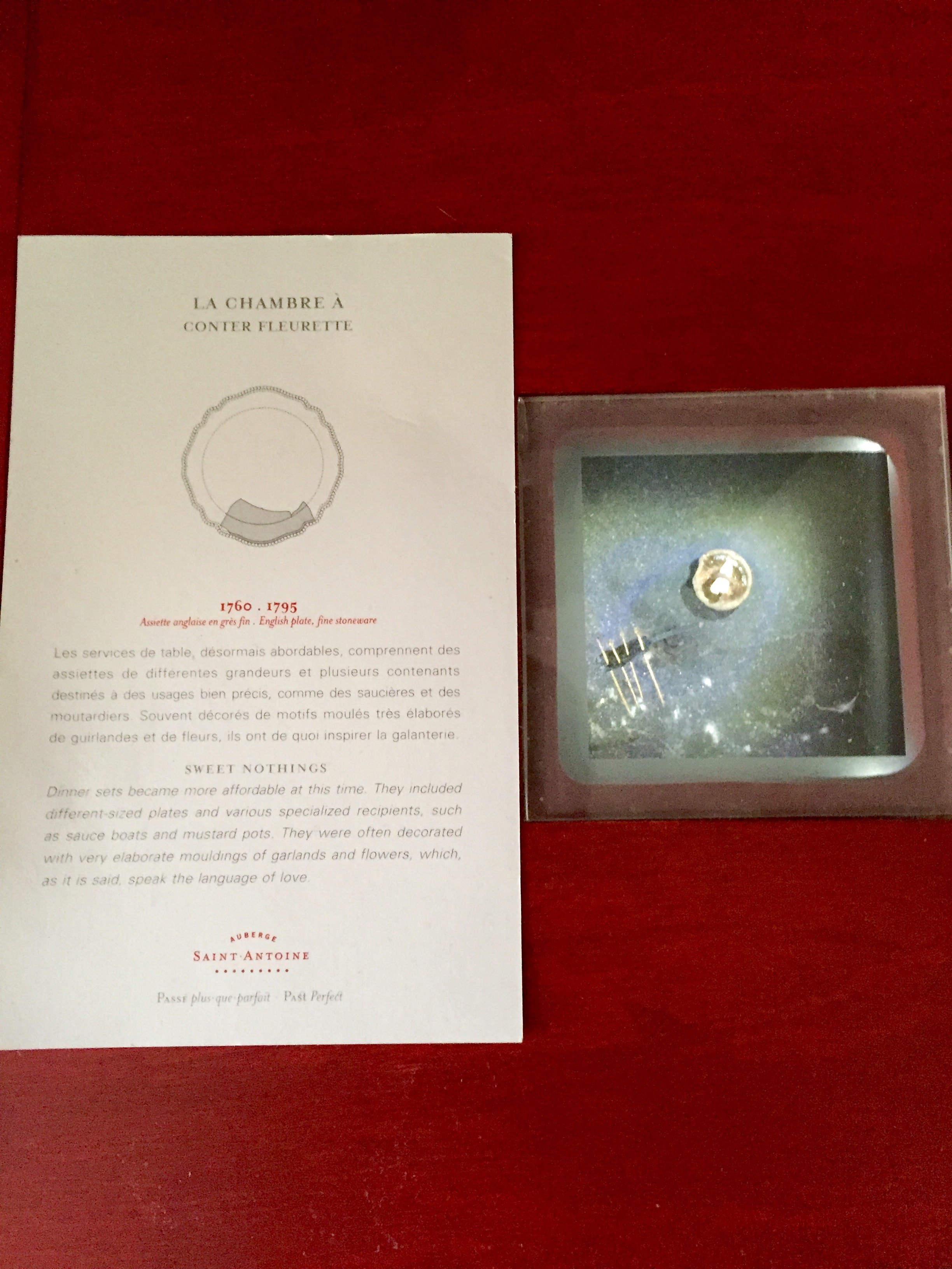 In room historic artifacts with written descriptions in each room at the Auberge Saint-Antoine