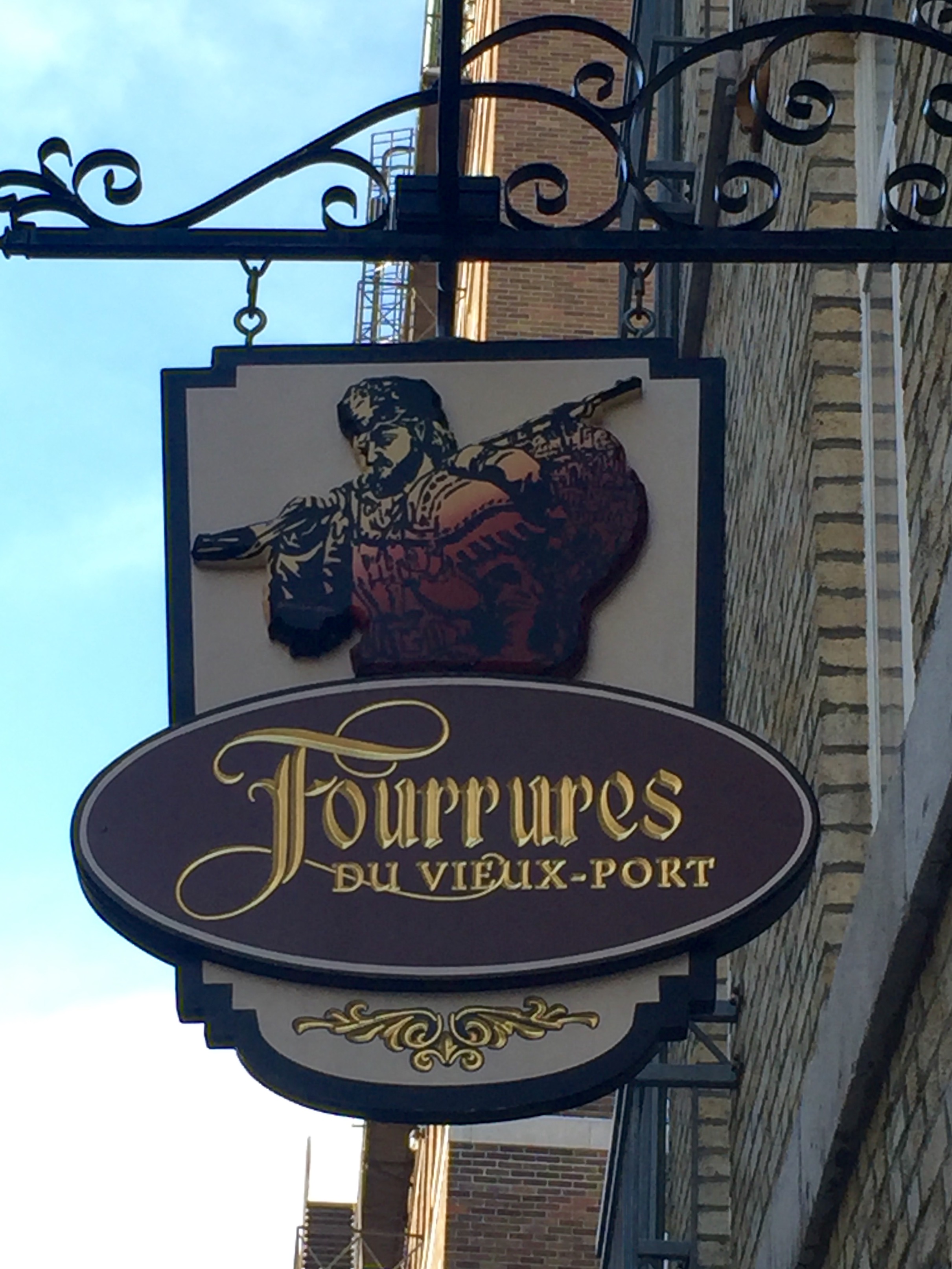 An old hanging store sign in Old Quebec City