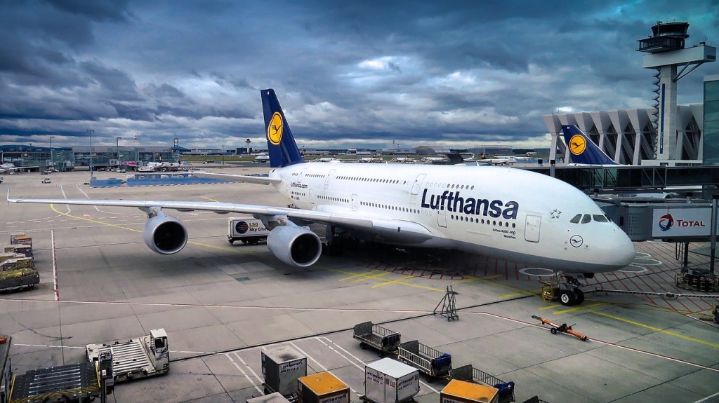 Lufthansa airplane sitting on an airport.