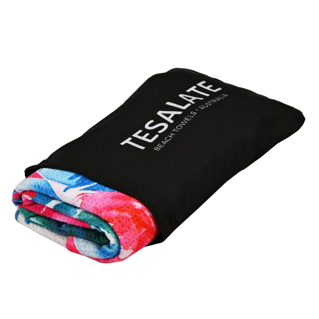 A Tesalate towel rolled up in its carry pack