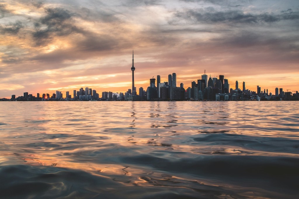 A skyline of Toronto during a sunset