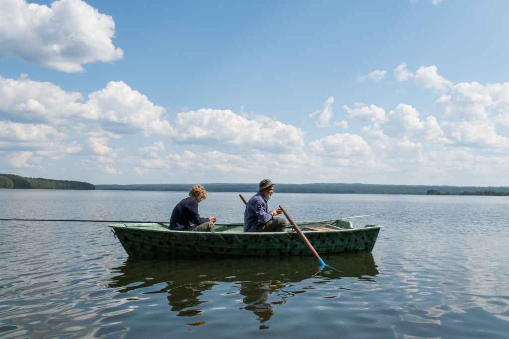 A family in a boat on a lake