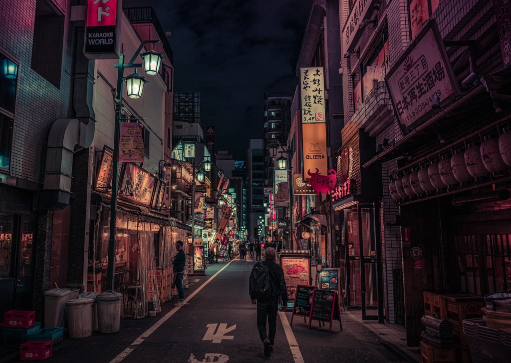 A man is walking in the alley.