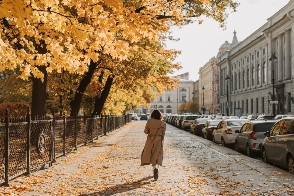 Woman walking on a street during autumn