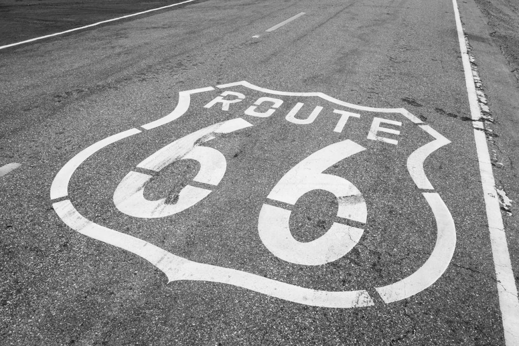 large Route 66 shield painted on the asphalt road surface